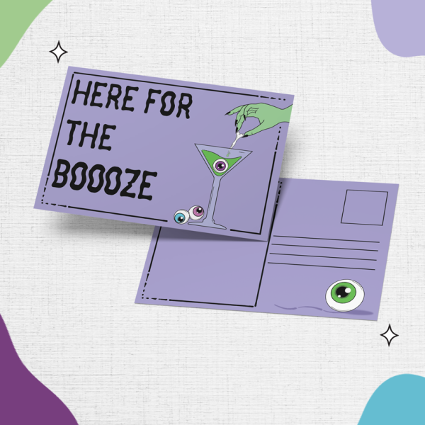 The "Here For The Boooze Postcard" showcases a purple background with the playful text "HERE FOR THE BOOOZE" on the front, accompanied by a martini glass adorned with an eyeball garnish. The reverse side features a green eyeball in the stamp area and provides ample space for writing an address and message.