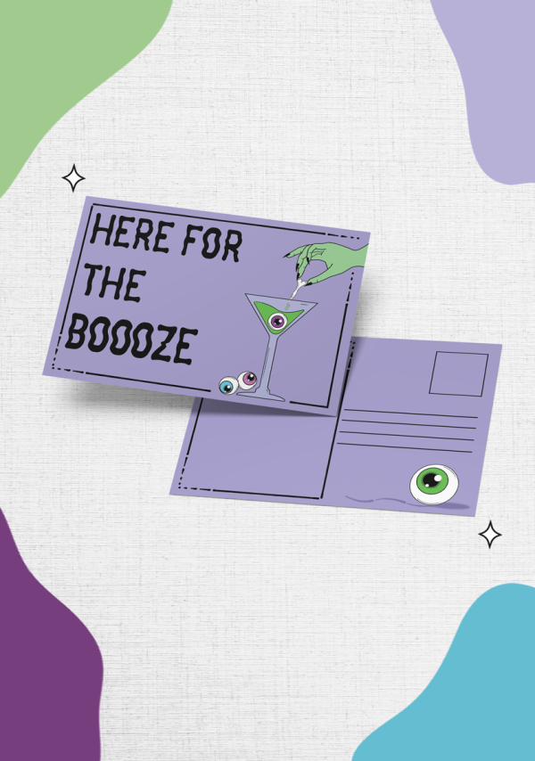 The "Here For The Boooze Postcard" showcases a purple background with the playful text "HERE FOR THE BOOOZE" on the front, accompanied by a martini glass adorned with an eyeball garnish. The reverse side features a green eyeball in the stamp area and provides ample space for writing an address and message.