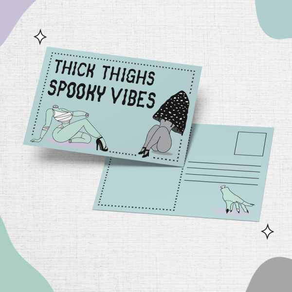 Introducing the "Thick Thighs, Spooky Vibes" featuring illustrations of two figures and the text "THICK THIGHS SPOOKY VIBES" on the front. The back offers space for an address and includes a small drawing of a hand perched on a pink shadow, set against pastel-colored abstract shapes in the background.