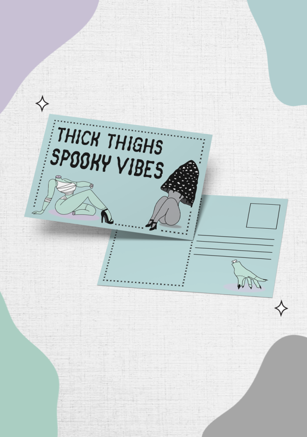 Introducing the "Thick Thighs, Spooky Vibes" featuring illustrations of two figures and the text "THICK THIGHS SPOOKY VIBES" on the front. The back offers space for an address and includes a small drawing of a hand perched on a pink shadow, set against pastel-colored abstract shapes in the background.