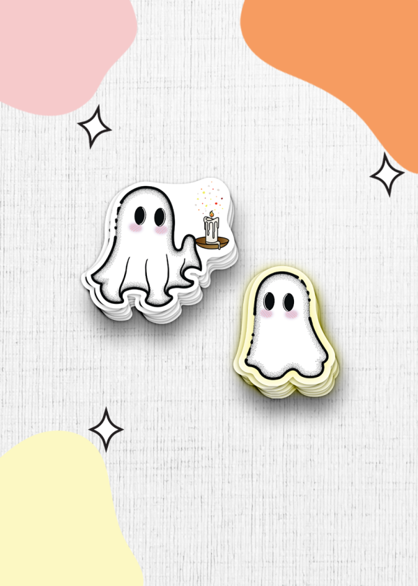 The "You Light Up My Life Sticker Duo" features two adorable cartoon ghost stickers set against a light textured background. The ghost on the left is holding a candle adorned with multicolored sparkles, while both ghosts sport pink cheeks and big black eyes for an irresistibly cute appearance. Their backdrop is decorated with abstract pastel shapes and star accents.