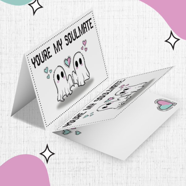 You're My Soulmate Valentines Card features a charming cartoon design of two adorable ghosts holding hands. The card is open, displaying the front message 'You're my soulmate,' surrounded by hearts around the ghosts. The background is a white canvas adorned with pink, teal, and purple blobs and star motifs.