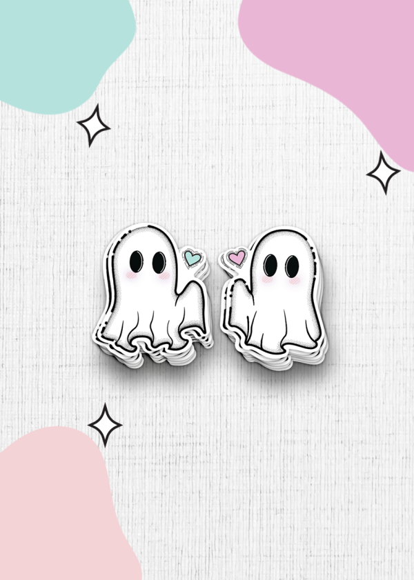 The "You're My Soulmate Sticker Duo" features two adorable ghost stickers with black eyes on a textured white background, each holding a small heart - one blue and one pink. Pastel-colored blobs and tiny sparkle designs decorate the corners, adding a charming touch.