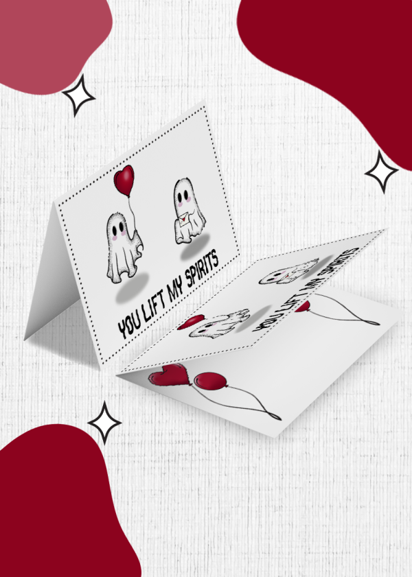 The Wish Boo Were Here Valentine’s Card is a 3D popup greeting card that features two cartoon ghosts holding heart-shaped balloons. The cover text at the bottom reads "YOU LIFT MY SPIRITS," with a background of white accompanied by red and maroon organic shapes and star accents.