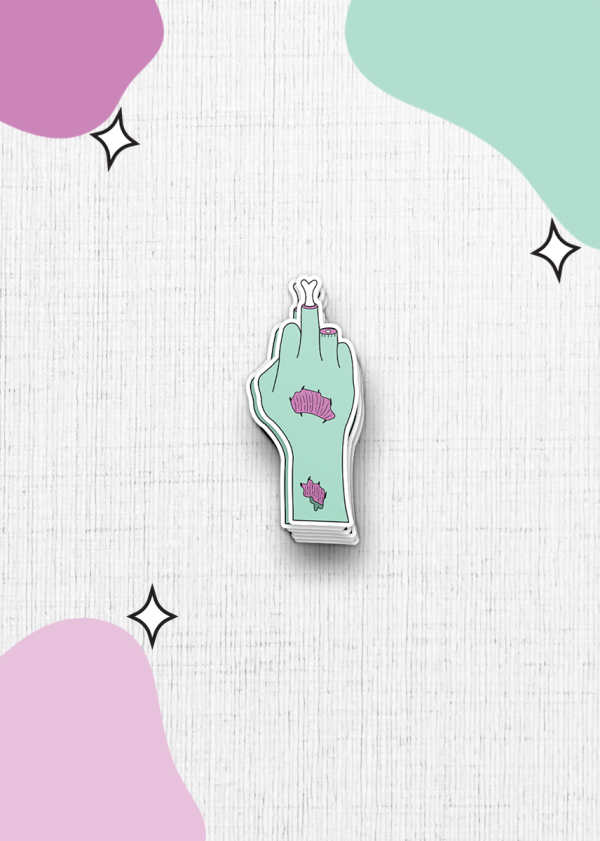 The sticker features a zombie hand showing the middle finger on a textured white background. The light green hand is adorned with pink peeling flesh. The background showcases abstract pastel pink and green shapes accompanied by small black star accents.